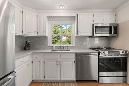 West Yarmouth Cape Cod vacation rental - Kitchen overlooking back patio
