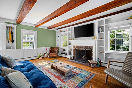 Provincetown, 248 Bradford Street Cape Cod vacation rental - Living room wth pull out futon + half bath.