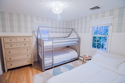 Centerville Cape Cod vacation rental - Kids' bedroom with queen size bed and 2 bunk beds