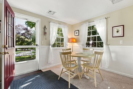 West Yarmouth Cape Cod vacation rental - Dining area with entrance to side yard