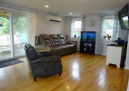 Sandwich - Town Neck Area Cape Cod vacation rental - Kitchen opens to family room with Smart TV, slider to deck