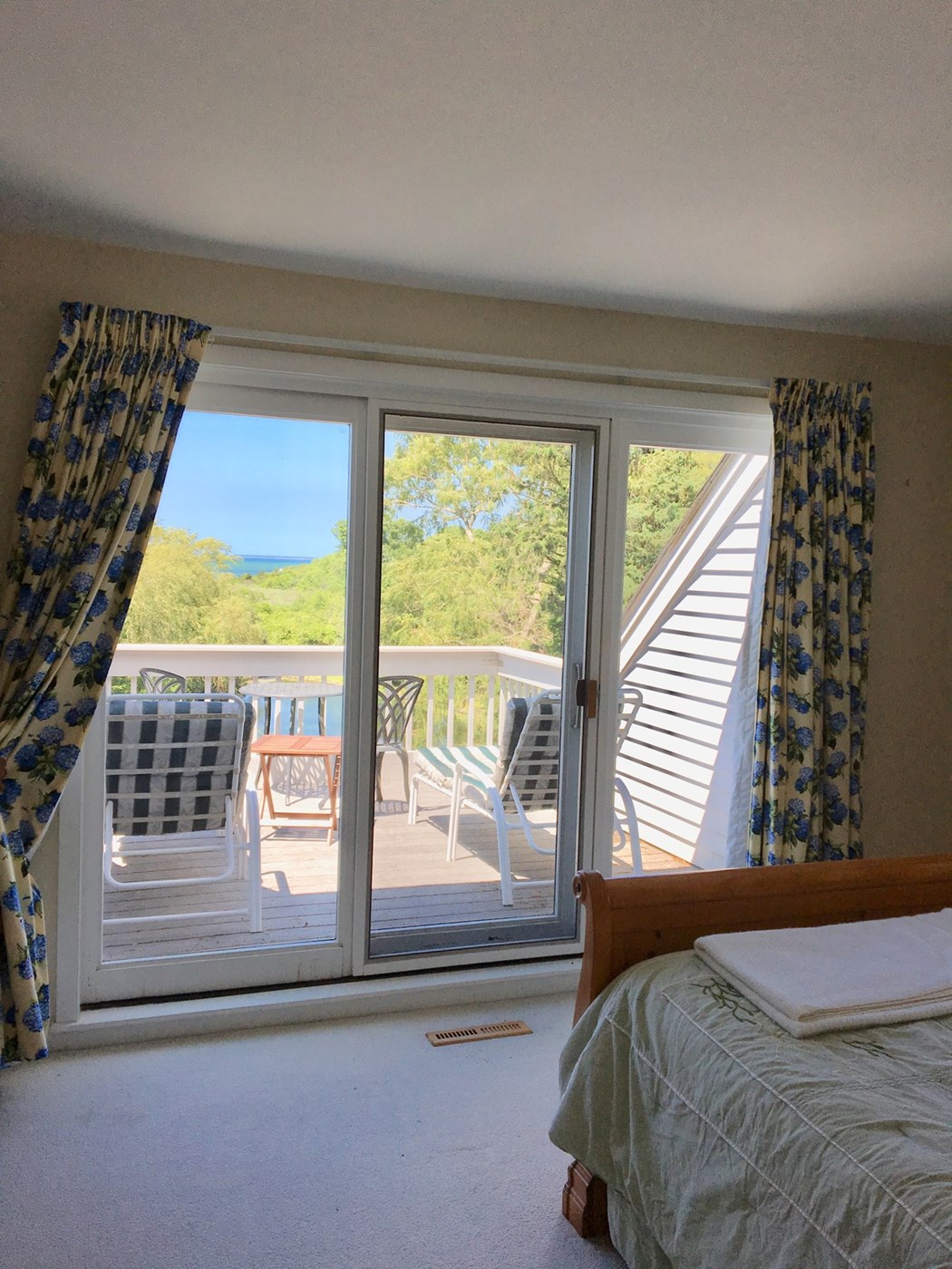 Bedroom with queen bed on first floor with full bathroom attached