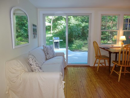 Wellfleet Cape Cod vacation rental - Living room opens to dining and kitchen, slider to deck