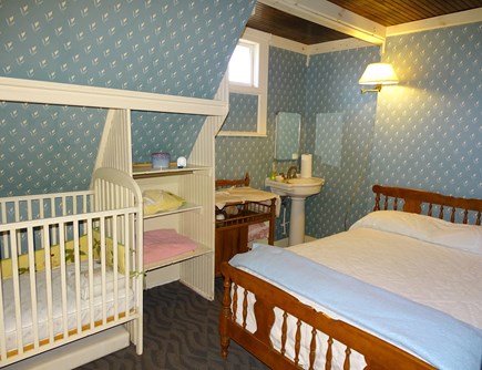 Falmouth Cape Cod vacation rental - Upstairs bedroom (full) with crib, changing table and sink.