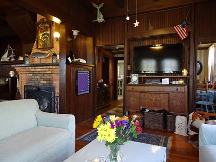 Falmouth Cape Cod vacation rental - Living room has sofas fireplace, old fashioned player piano.