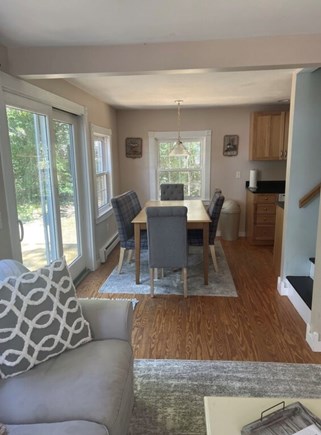South Dennis Cape Cod vacation rental - Living room includes fireplace and TV opens to dining room area