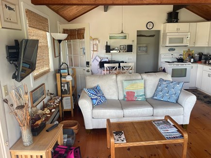 Wellfleet Harbor & Beach Cape Cod vacation rental - Living area showing HDTV, Cape art and office behind the couch