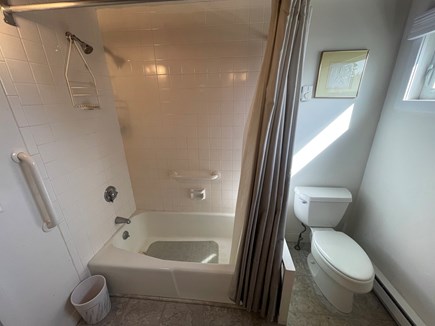 Wellfleet Harbor & Beach Cape Cod vacation rental - View of full-sized tub/shower and elongated toilet