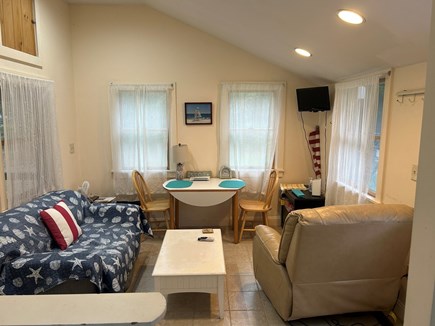 West Yarmouth Cape Cod vacation rental - Den with TV and door to back yard.