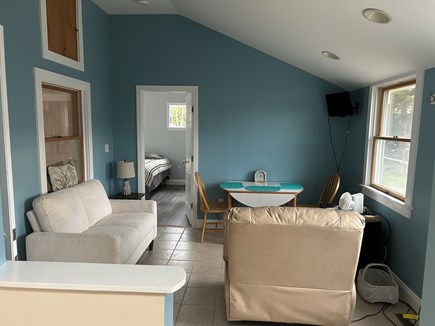 West Yarmouth Cape Cod vacation rental - Den with TV and doors to bedroom and yard.