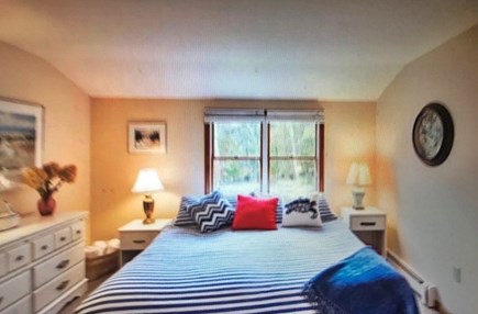 Eastham Cape Cod vacation rental - King size bed in upstairs bedroom with nautical blue theme.