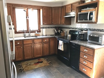 Eastham Cape Cod vacation rental - Kitchen with granite countertops and stainless appliances.