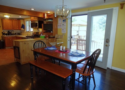 West Yarmouth Cape Cod vacation rental - Dining area leads to kitchen and slider to pool and deck