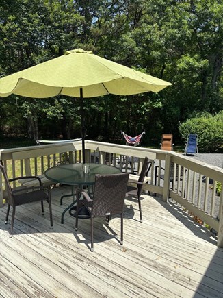 Popponesset/New Seabury  Cape Cod vacation rental - Back Yard with Fire Pit, Dinning area, Grille and Outside Shower.