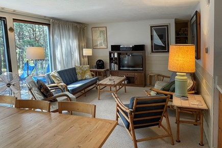 North Eastham Cape Cod vacation rental - Living room (two 8 foot sliders overlook pine grove)