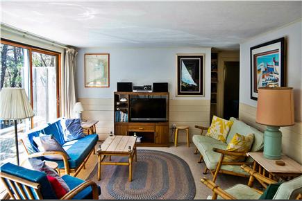 North Eastham Cape Cod vacation rental - Living room (two 8 foot sliders overlook pine grove)