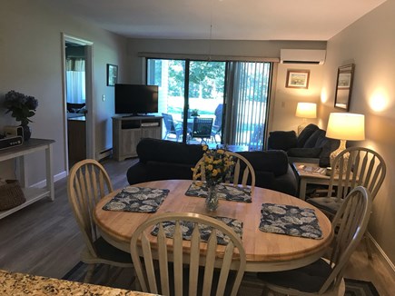 Ocean Edge, Brewster Cape Cod vacation rental - Dining room/living room with slider to patio.