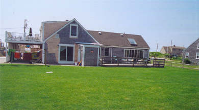 West Dennis Cape Cod vacation rental - Back of house showing yard & decks
