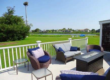 West Dennis Cape Cod vacation rental - Back deck with gas fireplace, facing the water