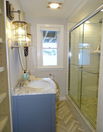 West Dennis Cape Cod vacation rental - First floor bathroom with glass shower 