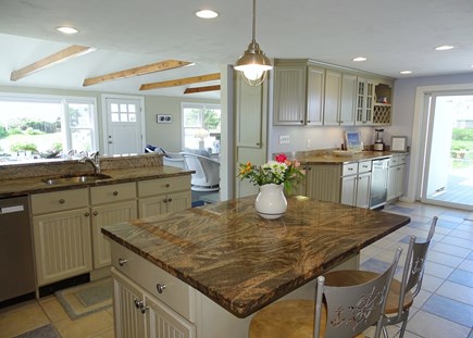 West Dennis Cape Cod vacation rental - Kitchen showing openness to dining and living areas 