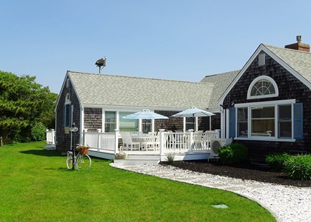 West Dennis Cape Cod vacation rental - Front deck with two dining tables and outdoor shower 