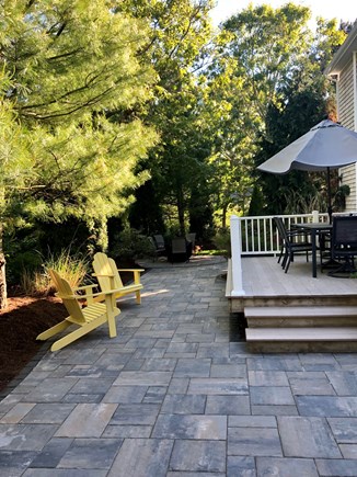 West Harwich Cape Cod vacation rental - Large backyard patio & fire table w/ample space to entertain