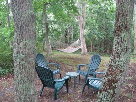 Brewster Cape Cod vacation rental - Take a break from sun in shady back yard with hammock.