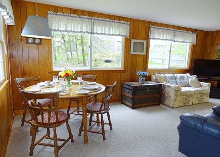 South Chatham Cape Cod vacation rental - Dining area leads to family room, TV, slider to back yard