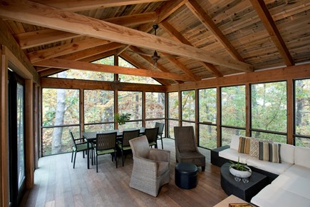 Wellfleet Cape Cod vacation rental - Screened in porch with dining table
Bug free looking into woods