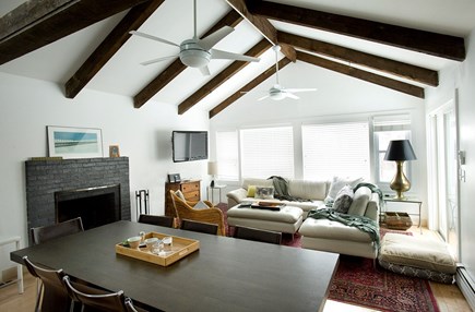 Wellfleet Cape Cod vacation rental - Main space of house with sectional sofa and indoor dining table