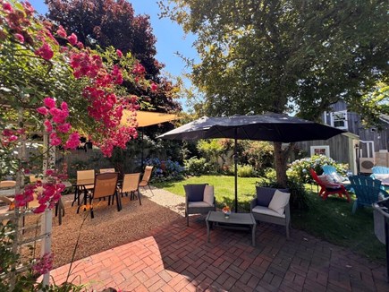 West Harwich Cape Cod vacation rental - Patio to shade covered dining tables to fit 12+ w roses/hydrangea
