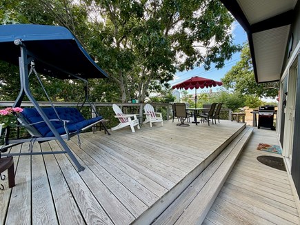 Wellfleet Cape Cod vacation rental - Large deck w/ table for 6, porch swing, grill, 2 adirondack chair