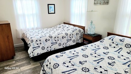 South Yarmouth Cape Cod vacation rental - Front bedroom with two double beds.  All new beds and bedding
