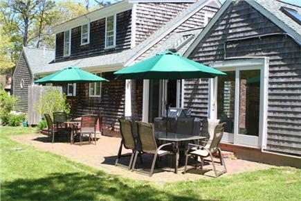 Brewster, The Highlands Cape Cod vacation rental - Dining for 12 outside with gas grill and yard games.