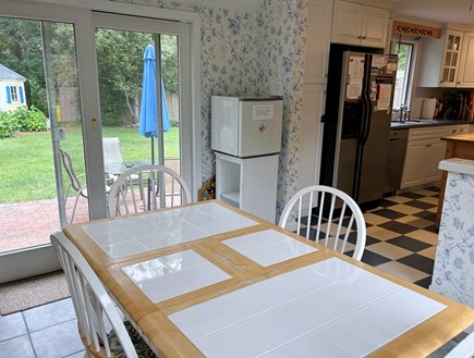 Brewster, The Highlands Cape Cod vacation rental - Sunroom off kitchen, facing slider to back yard