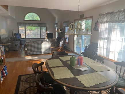 Wellfleet Cape Cod vacation rental - Dining Area and Living Room with Deck and Patio via Sliding Door