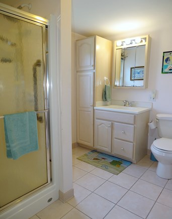 Falmouth Cape Cod vacation rental - Master bathroom that holds washer/dryer