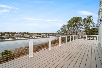 West Dennis Cape Cod vacation rental - L-shaped deck on the second floor looking out on the water
