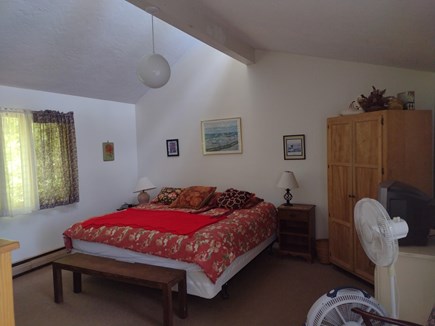 Wellfleet Cape Cod vacation rental - Main bedroom, king bed, entry level. TV, sliders to deck