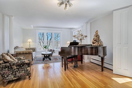 Truro Cape Cod vacation rental - Seating area, baby grand piano and well-stocked game closet await