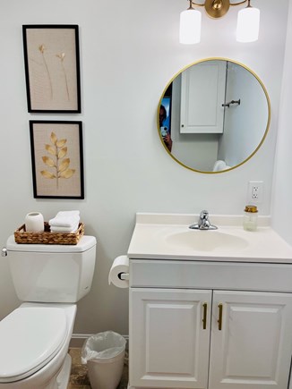 Harwich Port Cape Cod vacation rental - Elegant bathroom w/walk-in shower & stacked washer & dryer unit
