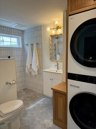Harwich Port Cape Cod vacation rental - Designer bath with stacked laundry, curbless walk-in shower