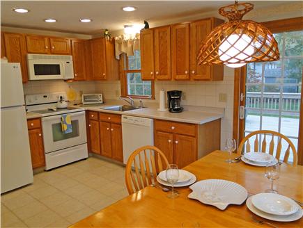 East Falmouth Cape Cod vacation rental - Kitchen and dining area, sliders to deck