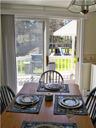 South Yarmouth Cape Cod vacation rental - Dining Room w/ slider to deck with grill & backyard w/play area