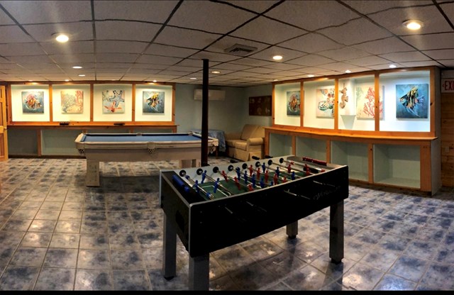 Walk to the beach from this home with a game room