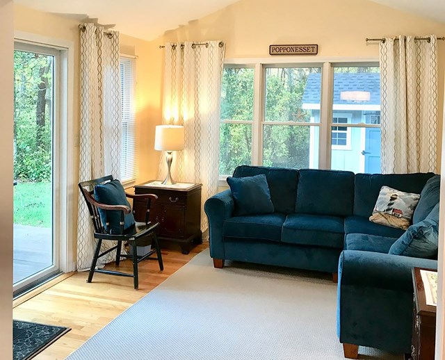 Walk to the beach from this home in Popponesset