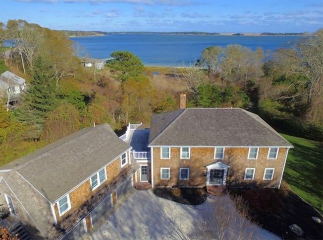 Waterfront home situated on 4 wooded acres