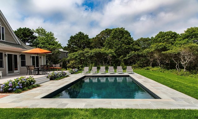 Walk to town from this home offering a gorgeous Gunite pool
