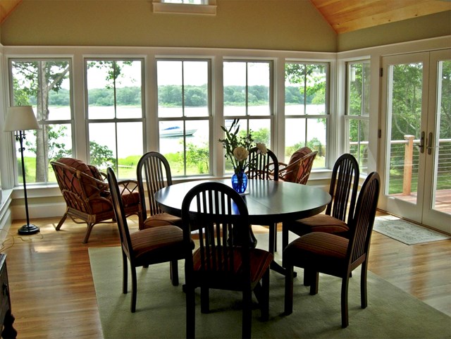 Edgartown home situated in an idyllic private wooded setting on a pond